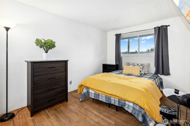 bedroom featuring wood finished floors