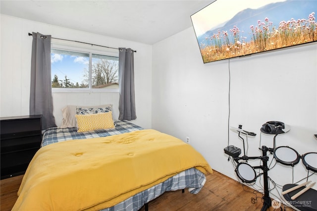 bedroom featuring wood finished floors