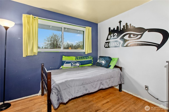 bedroom featuring wood finished floors