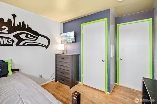 bedroom with wood finished floors