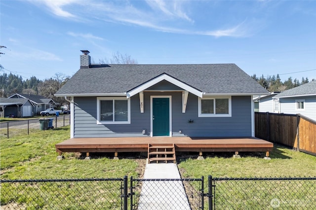 bungalow-style house with a shingled roof, a fenced backyard, a chimney, a gate, and a front lawn