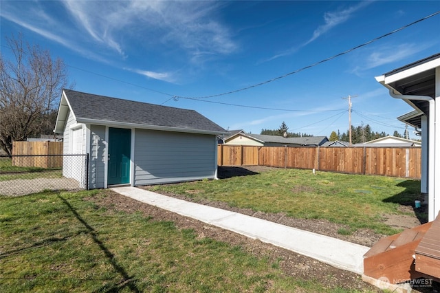 view of yard with an outbuilding and a fenced backyard