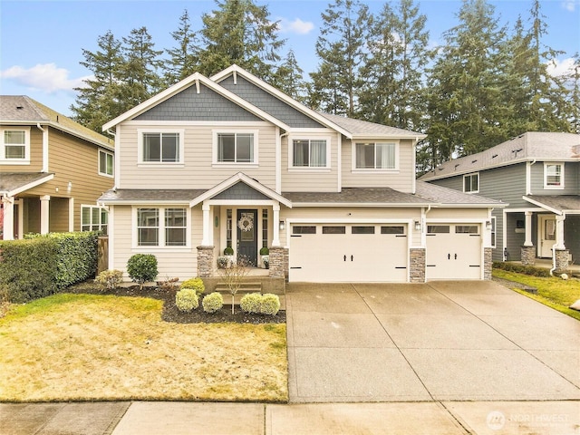 craftsman house featuring a shingled roof, stone siding, driveway, and an attached garage