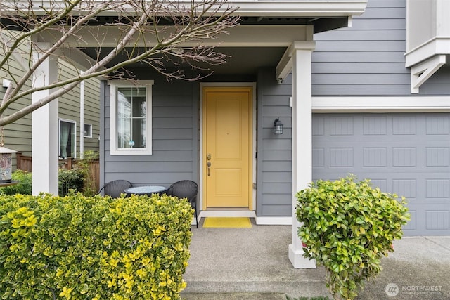 property entrance with a garage