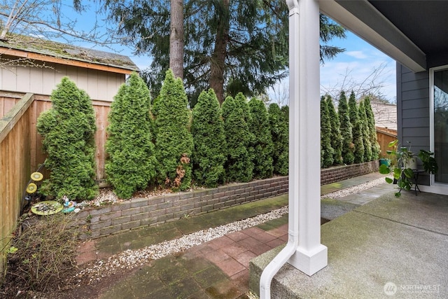 view of patio featuring fence