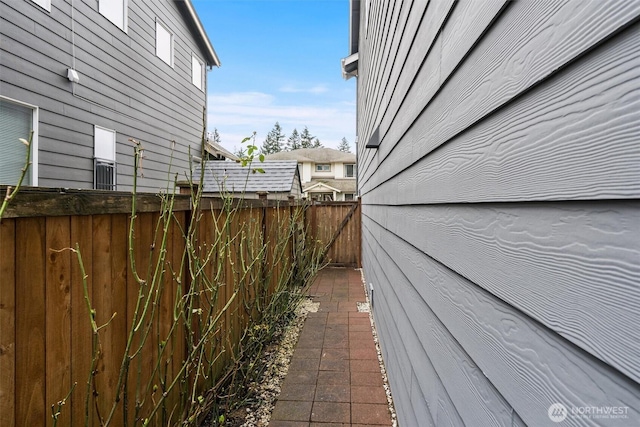 view of side of home with fence