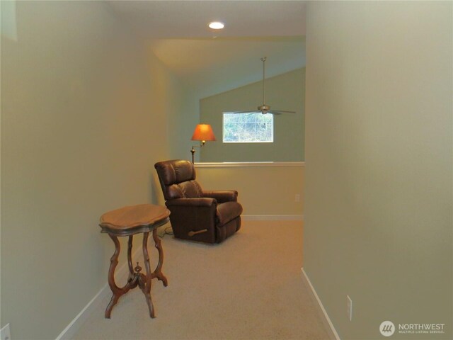 living area with lofted ceiling, recessed lighting, carpet, and baseboards