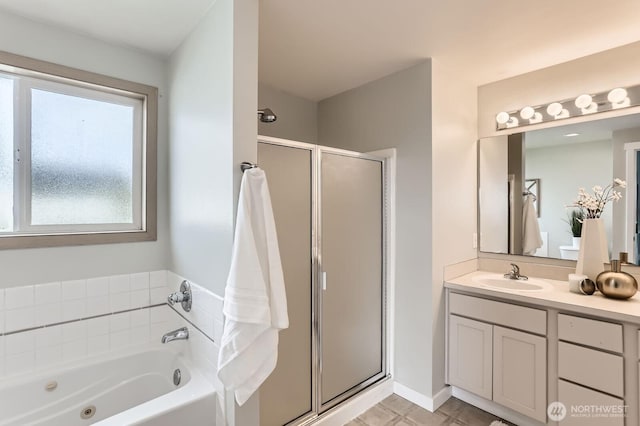 bathroom featuring vanity, a whirlpool tub, and a shower stall