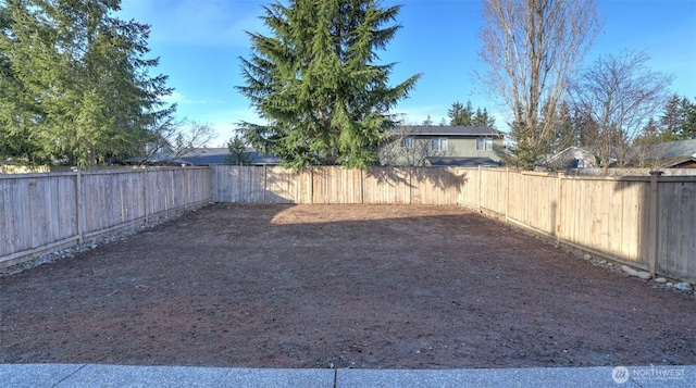 view of yard featuring a fenced backyard