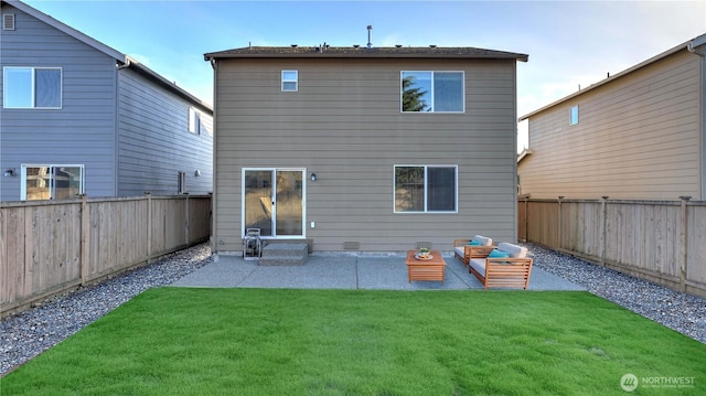 back of property with a patio, a lawn, and a fenced backyard