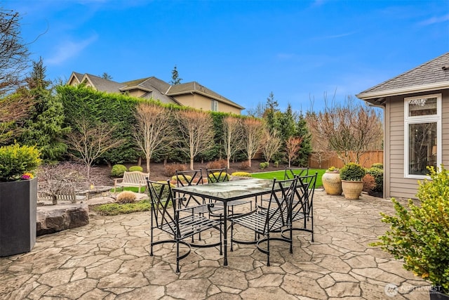 view of patio / terrace featuring outdoor dining area and fence