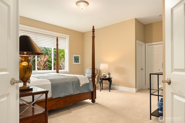 carpeted bedroom with baseboards