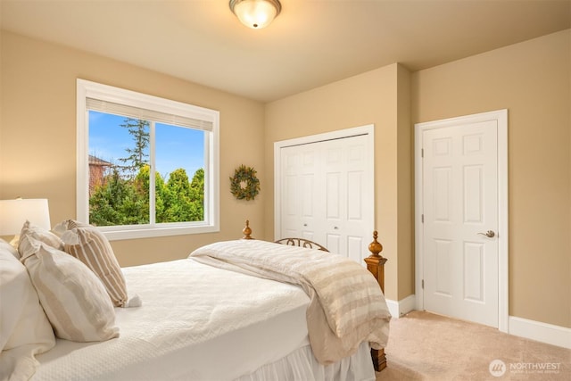 bedroom featuring baseboards, a closet, and carpet floors