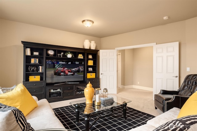 carpeted living room with baseboards