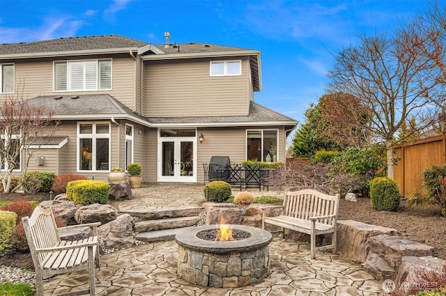 back of house with a patio, fence, french doors, and an outdoor fire pit