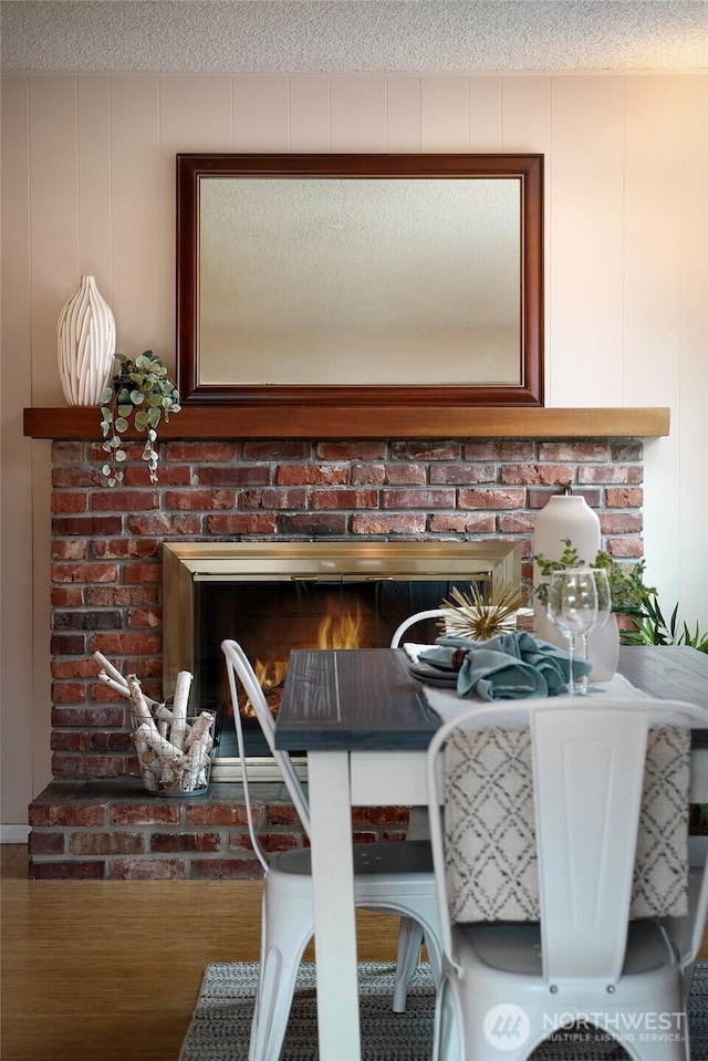 interior details featuring a fireplace and a textured ceiling