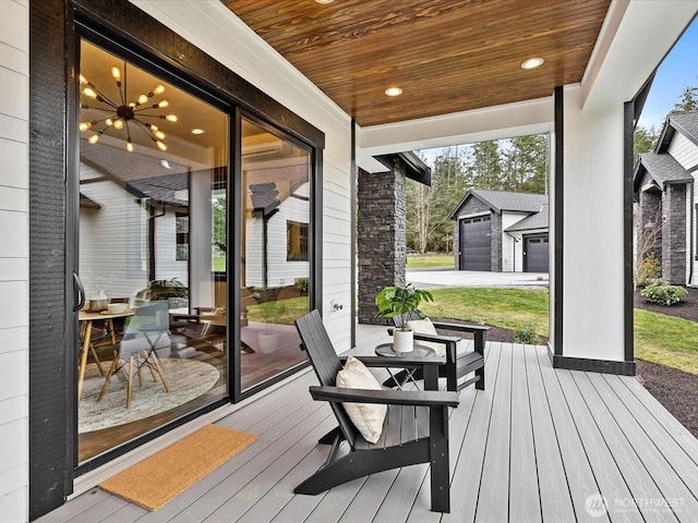 wooden deck featuring a detached garage