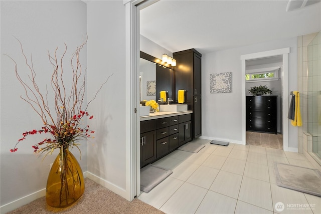 bathroom featuring tile patterned floors, visible vents, vanity, and baseboards