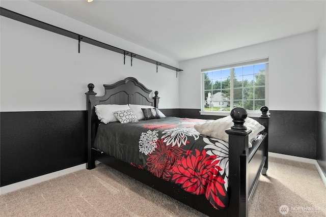 carpeted bedroom with baseboards