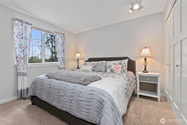 bedroom with carpet and baseboards