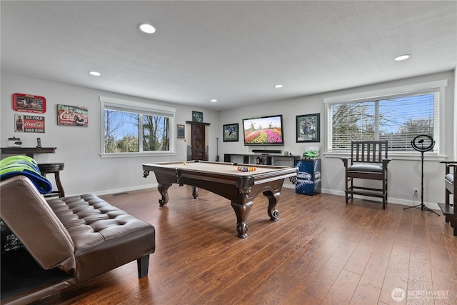 game room with a healthy amount of sunlight, baseboards, and hardwood / wood-style floors