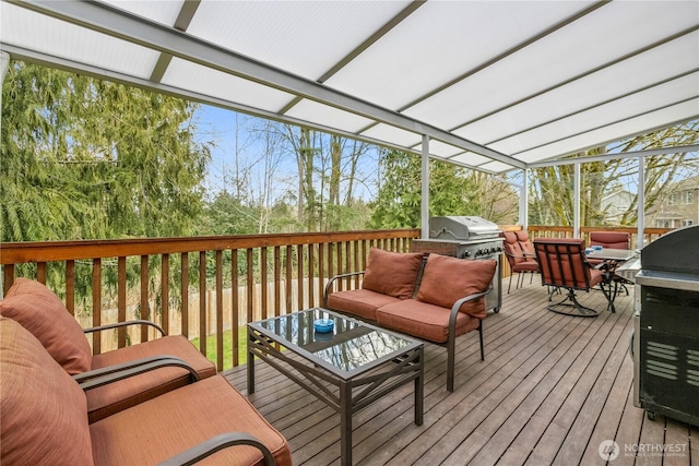 deck with an outdoor hangout area and area for grilling