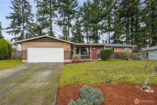 ranch-style house featuring fence, concrete driveway, a front yard, a garage, and a chimney