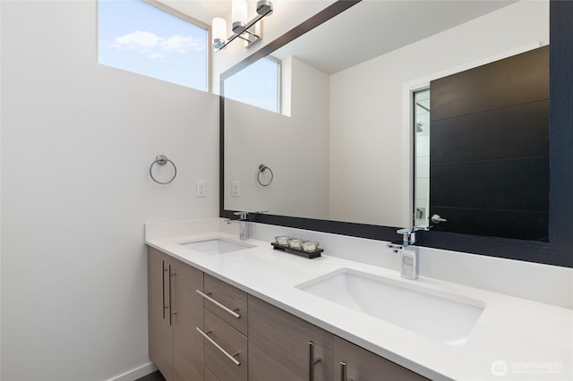 full bath with a sink and double vanity