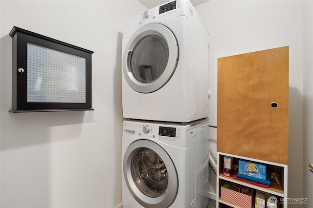 laundry area featuring laundry area and stacked washer and clothes dryer