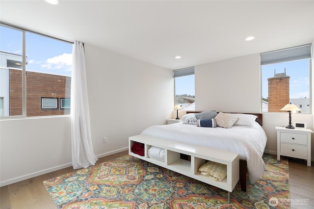 bedroom featuring recessed lighting, baseboards, and wood finished floors