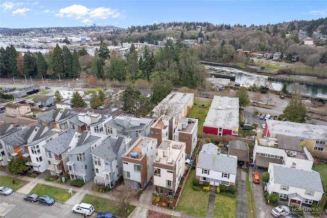 bird's eye view with a water view and a residential view