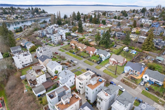 bird's eye view with a residential view and a water view