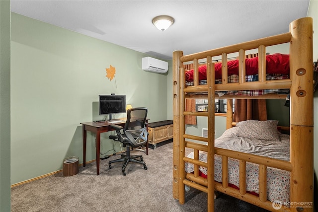 carpeted bedroom featuring baseboards and a wall mounted AC