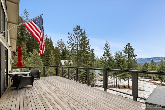 wooden terrace with a mountain view