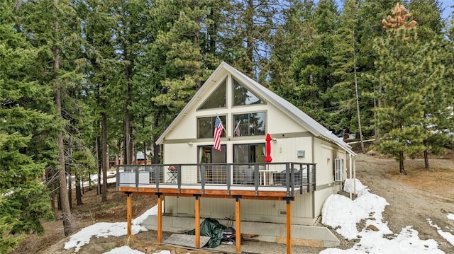 chalet / cabin with a wooden deck