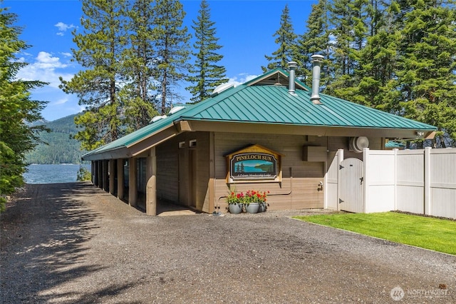 exterior space with a standing seam roof, metal roof, and a mountain view