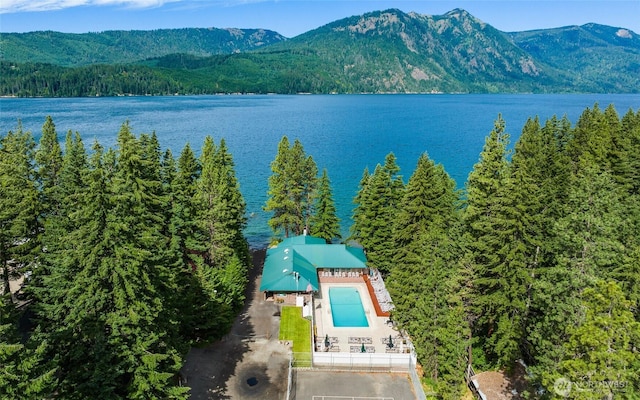 bird's eye view with a forest view and a water and mountain view