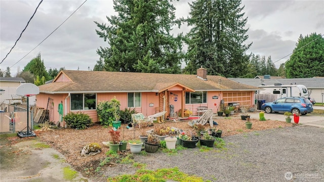 single story home featuring fence and a chimney