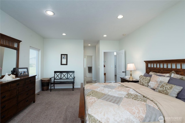 bedroom featuring light carpet, baseboards, and recessed lighting