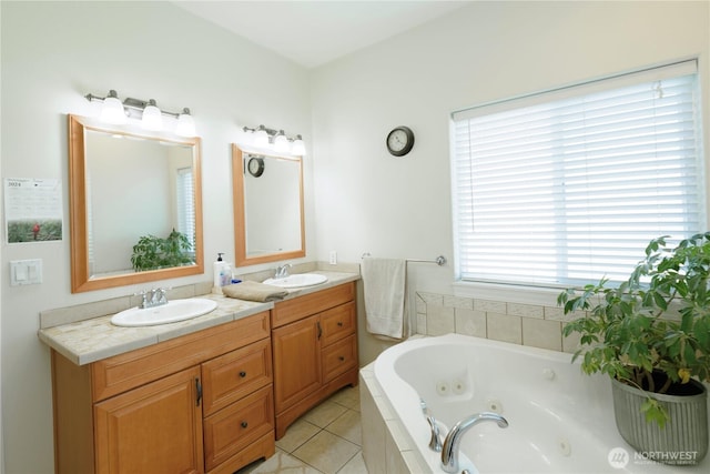 bathroom with double vanity, tile patterned flooring, a sink, and a whirlpool tub
