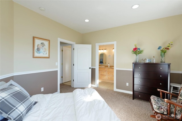 bedroom with light carpet, baseboards, connected bathroom, and recessed lighting