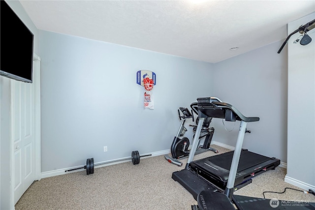exercise area with carpet floors and baseboards