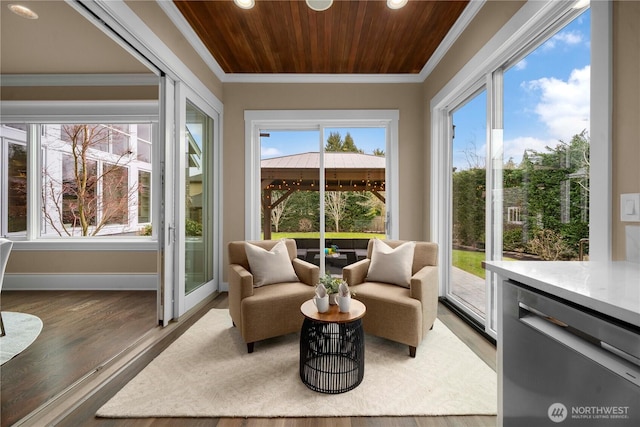 sunroom featuring recessed lighting, wood finished floors, ornamental molding, baseboards, and wood ceiling