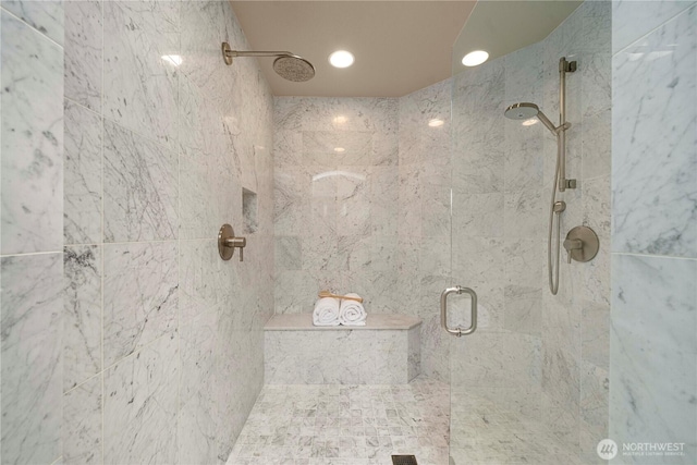 bathroom featuring recessed lighting and a shower stall