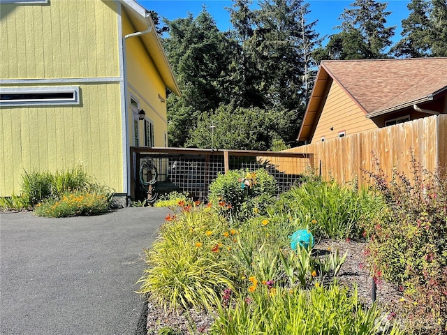 view of property exterior featuring fence