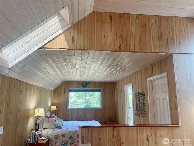 bedroom featuring lofted ceiling, wooden ceiling, and wood walls