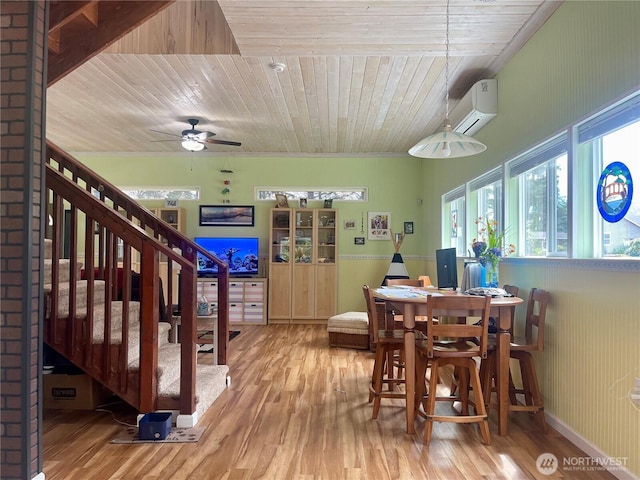 dining room with wood ceiling, stairs, wood finished floors, and a wall mounted AC