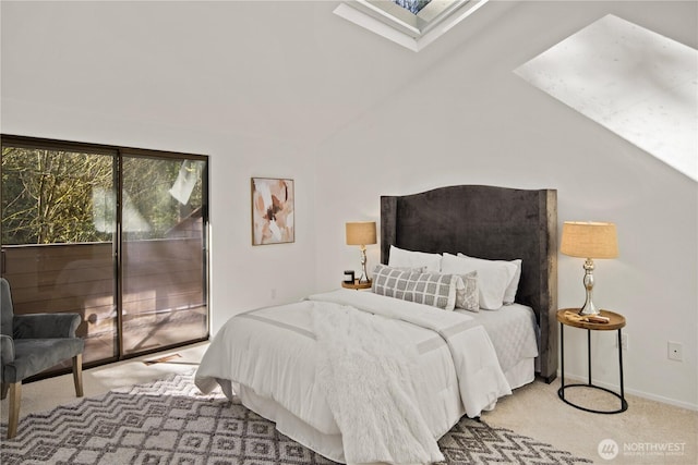 carpeted bedroom featuring baseboards, vaulted ceiling with skylight, and access to exterior