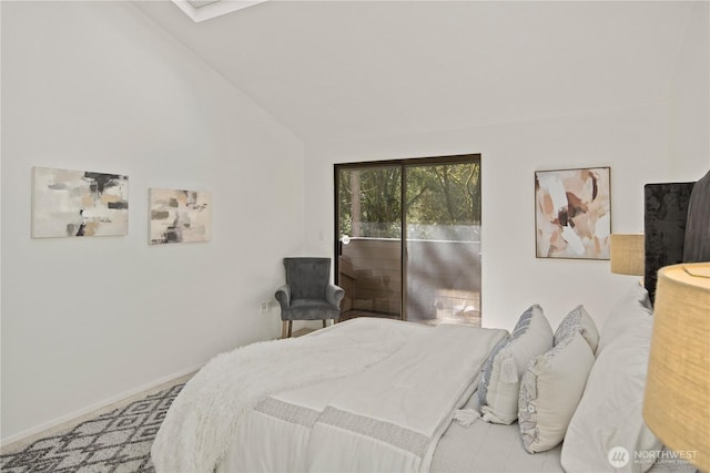 bedroom featuring vaulted ceiling, access to outside, and baseboards