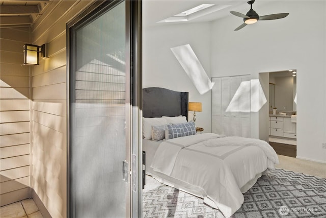 bedroom with a skylight and ceiling fan